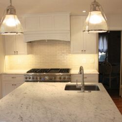 Remodeled kitchen with island sink and gas range