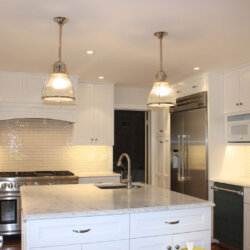 Hanging light fixtures in renovated kitchen