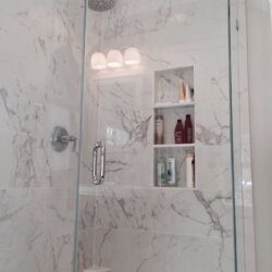 Built-in shower shelves in corner shower