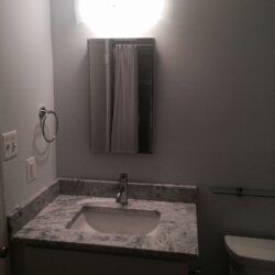 Gray remodeled bathroom in Rockville, MD