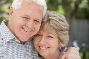 Senior couple smiling portrait outdoors