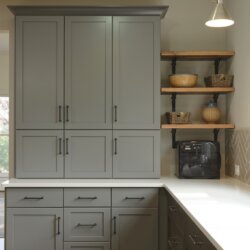 Gray drawers and cabinets in renovated kitchen