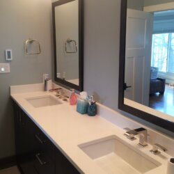 Double bathroom sinks with matching vanity mirrors