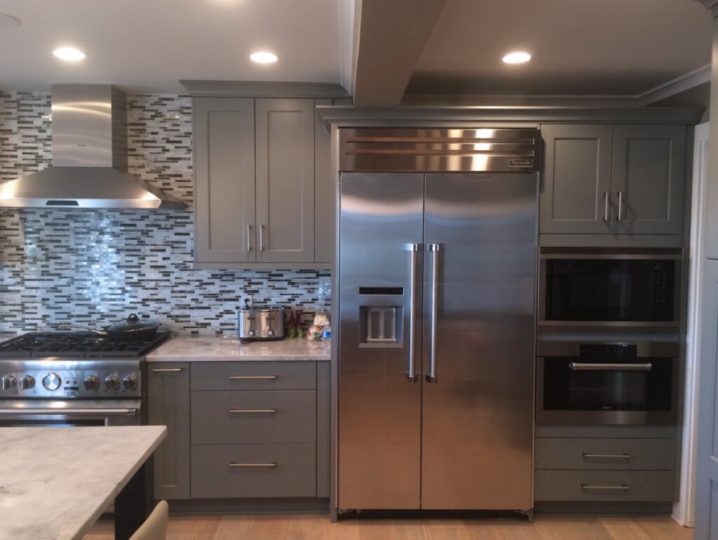 Stainless steel fridge in remodeled kitchen