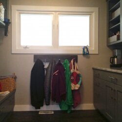 Remodeled mudroom with jackets