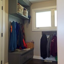 Coats hanging in new mudroom