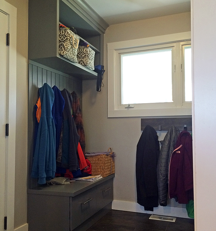 Photo: home remodeling with entry bench and coat hooks