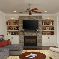 Living room with TV and fireplace