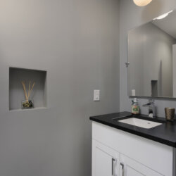 Modern gray bathroom sink and wall alcove