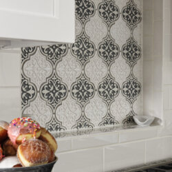 Decorative backsplash behind high end gas range