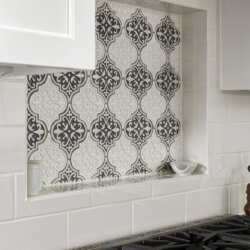 Decorative backsplash behind high end gas range