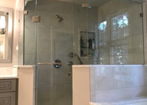 Glass walled corner shower in master bathroom
