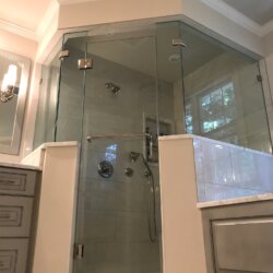 Glass walled corner shower in master bathroom
