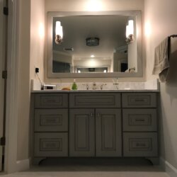 Master bathroom vanity with gray cabinetry