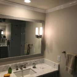 Sink and mirror in remodeled bathroom